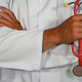 Hands of a man holding statoscope