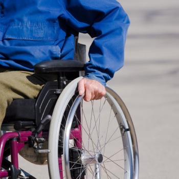 a man sitting on a wheel chair