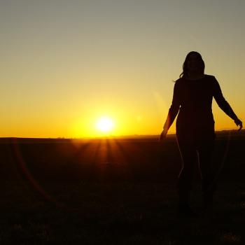 woman shadow infront of a sunset