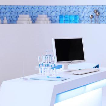 toothbrush and computer in dental clinic